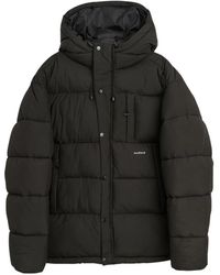 Soulland - Jassen ,Zwart ,Polyester Gewatteerde Jas Met Capuchon - Lyst