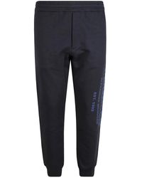 McQueen - Broeken ,Blauw ,Katoen Blauw Logo Katoenen Trainingsbroeken - Lyst