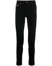 Versace - Jeans slim-fit neri per uomo - Lyst
