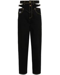 Versace - Gerade Jeans mit Logo-Gravur - Lyst