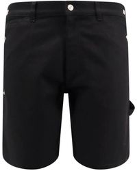 Courreges - Shorts neri con chiusura a zip e bottone - Lyst