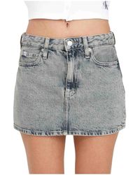 Calvin Klein - Falda mini de mezclilla lavado claro cintura alta - Lyst