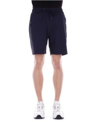 CoSTUME NATIONAL - Shorts blu cnc tasche con zip - Lyst