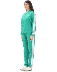 adidas - Sportliches Essentials 3-Streifen Grüner Jumpsuit - Lyst