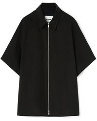 Jil Sander - Camicia nera in cotone biologico a maniche corte con zip e logo in rilievo - Lyst