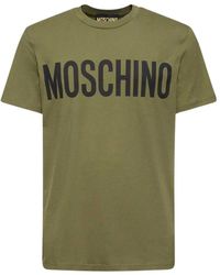 Moschino - Baumwoll t-shirt mit logo-print - grün - Lyst