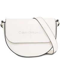 Calvin Klein - Handtasche sculpted saddle bag22 mono k60k611223 white/silver logo 0li - Lyst