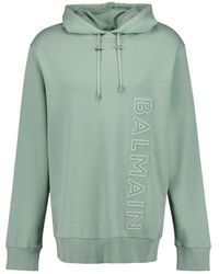 Balmain - Groene Katoenen Hoodie Met Reliëflogo - Lyst
