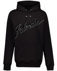 Balmain - Hoodies & Sweatvesten ,Zwart ,Katoen Zwart Flocked Sweatshirt Met Logo - Lyst
