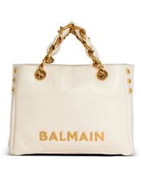 Balmain - Kleine tasche 1945 soft aus rissigem kalbsleder mit eingeprägtem monogramm pb labyrinthe - Lyst