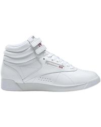 Reebok - Weiß/silber high top sneakers - Lyst