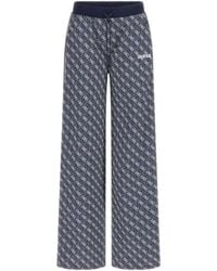 Guess - Pantaloni blu con logo - Lyst