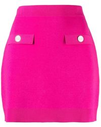 Michael Kors - Logo-Embossed Buttoned Miniskirt - Lyst