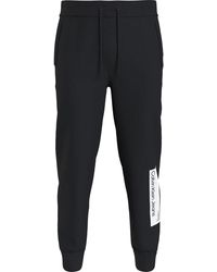 Calvin Klein - Logo Jumpsuit Zwarte Fleece Broek - Lyst