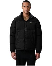 Lacoste - Jassen ,Zwart ,Polyester Waterafstotend Jack Met Capuchon En Donsvulling - Lyst