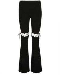 Nensi Dojaka - Geschnürte ausgestellte leggings in schwarz - Lyst