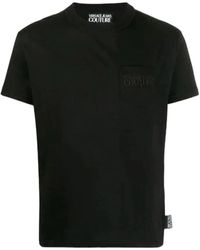 Versace - Schwarzes t-shirt mit besticktem logo - Lyst