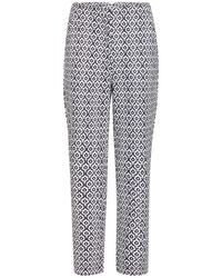 Ichi - Eclipse ikat aop high waist hose - Lyst