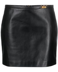 Versace - Minifalda de cuero negro con medusa - Lyst