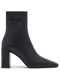 Courreges - Stivali in pelle nera con logo - Lyst