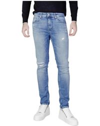 Tommy Hilfiger - Jeans denim blu con zip - Lyst