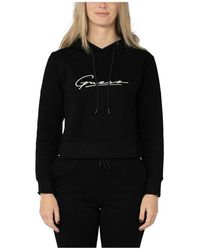 Ropa deportiva, de gimnasio y entrenamiento Guess de mujer: hasta el 60 %  de descuento | Lyst