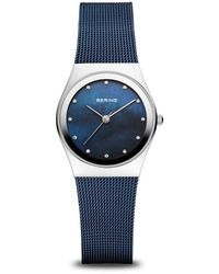 Bering - Armbanduhr classic silber glänzend mit blauem milanaise-armband 12927-307 - Lyst