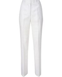 Genny - Trousers > slim-fit trousers - Lyst