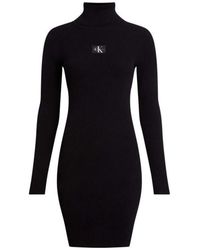 Calvin Klein - Kleedjes ,Zwart ,Zwarte Badge Roll Neck Sweater Jurk - Lyst