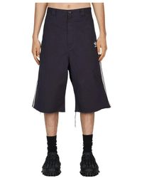 Balenciaga - Zerrissene denim-shorts mit charakteristischen streifen - Lyst