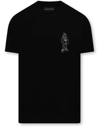 Emporio Armani - Magliette nera in cotone a manica corta con logo aquila cartoon ricamato - Lyst