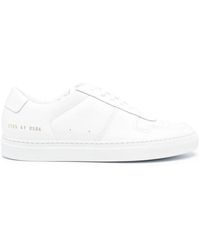 Common Projects - Sneakers basse in pelle bianca - Lyst
