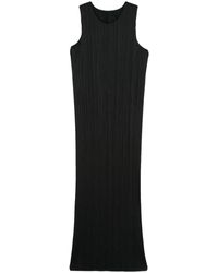 Issey Miyake - Elegante vestido negro para mujeres - Lyst