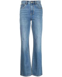 Tory Burch - Bootcut-Jeans mit hoher Taille in hellblauer Waschung - Lyst