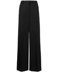 Versace - Pantalones negros de talle alto y pierna ancha - Lyst