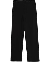 Ann Demeulemeester - Schwarze hose mit taschen und knöpfen - Lyst