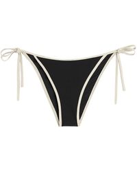 Totême - Fondo bikini nero con bordo a righe - Lyst