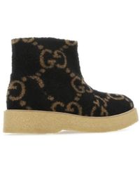 Gucci - Gg supreme faux-shearling stiefel - Lyst
