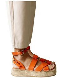 Mujer Zapatos de Zapatos planos sandalias y chanclas de Alpargatas y sandalias Enfiler des alpargatas Armani Exchange de Lona de color Naranja 