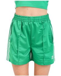 adidas Originals - Firebird verde bianco zip shorts - Lyst