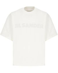 Jil Sander - Ivory baumwoll rundhals kurzarm pullover,weißes baumwoll-t-shirt mit frontdruck,weißes logo-t-shirt für lässigen stil - Lyst