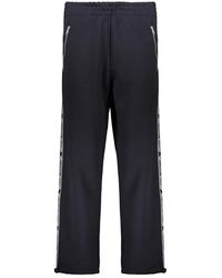 Moschino - Broeken ,Blauw ,Polyester Logo Streep Track Broek - Lyst