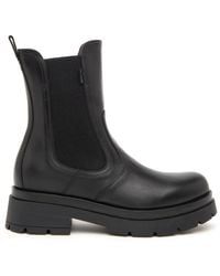 Nero Giardini - Lederstiefeletten mit elastischen seiten und schlaufe für einfaches anziehen - Lyst