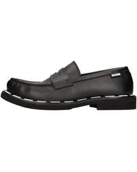 Moschino - Platte Schoenen Zwart - Lyst