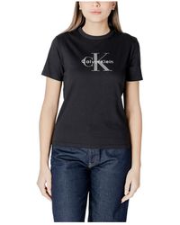 Calvin Klein - Tops ,Zwart ,Katoen Zwart Bedrukt Ronde Hals T-Shirt - Lyst