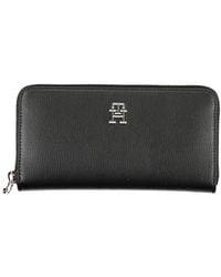 Tommy Hilfiger - Elegante schwarze geldbrse mit reiverschluss und mehreren fchern - Lyst