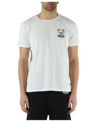 Moschino - T-shirt in cotone stretch con stampa logo a rilievo - Lyst