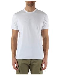 Guess - Slim fit baumwoll t-shirt mit frontlogo-stickerei - Lyst
