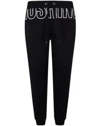 Moschino - Broeken ,Zwart ,Katoen Logo Print Fleece Joggers - Lyst