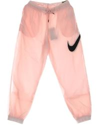 Nike - Fitness ,Roze ,Nylon Essentiële Geweven Broek - Lyst